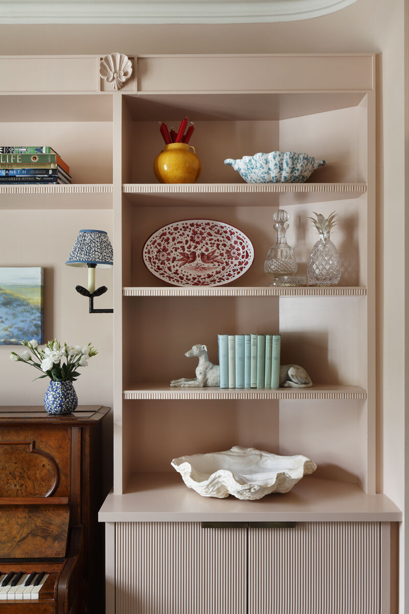 Close Up of Coral Shelving Surrounding Piano with Unusual and Captivating Ornaments Displayed